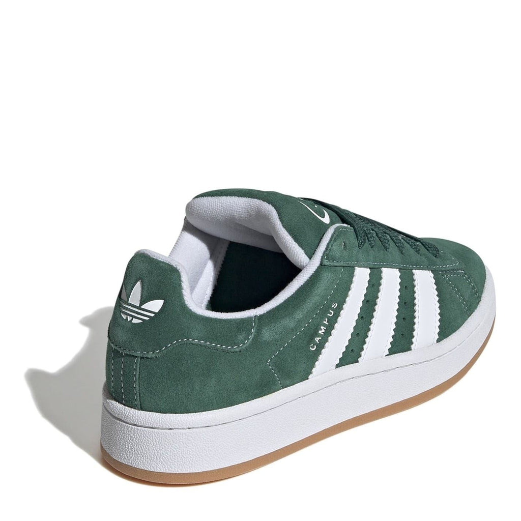 Juniors green suede trainers with white side stripes, white sole, padded collar.