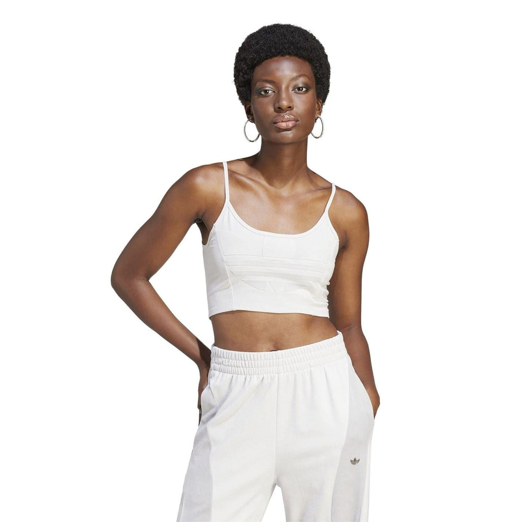 White cropped sports bra with thin straps and scooped neckline