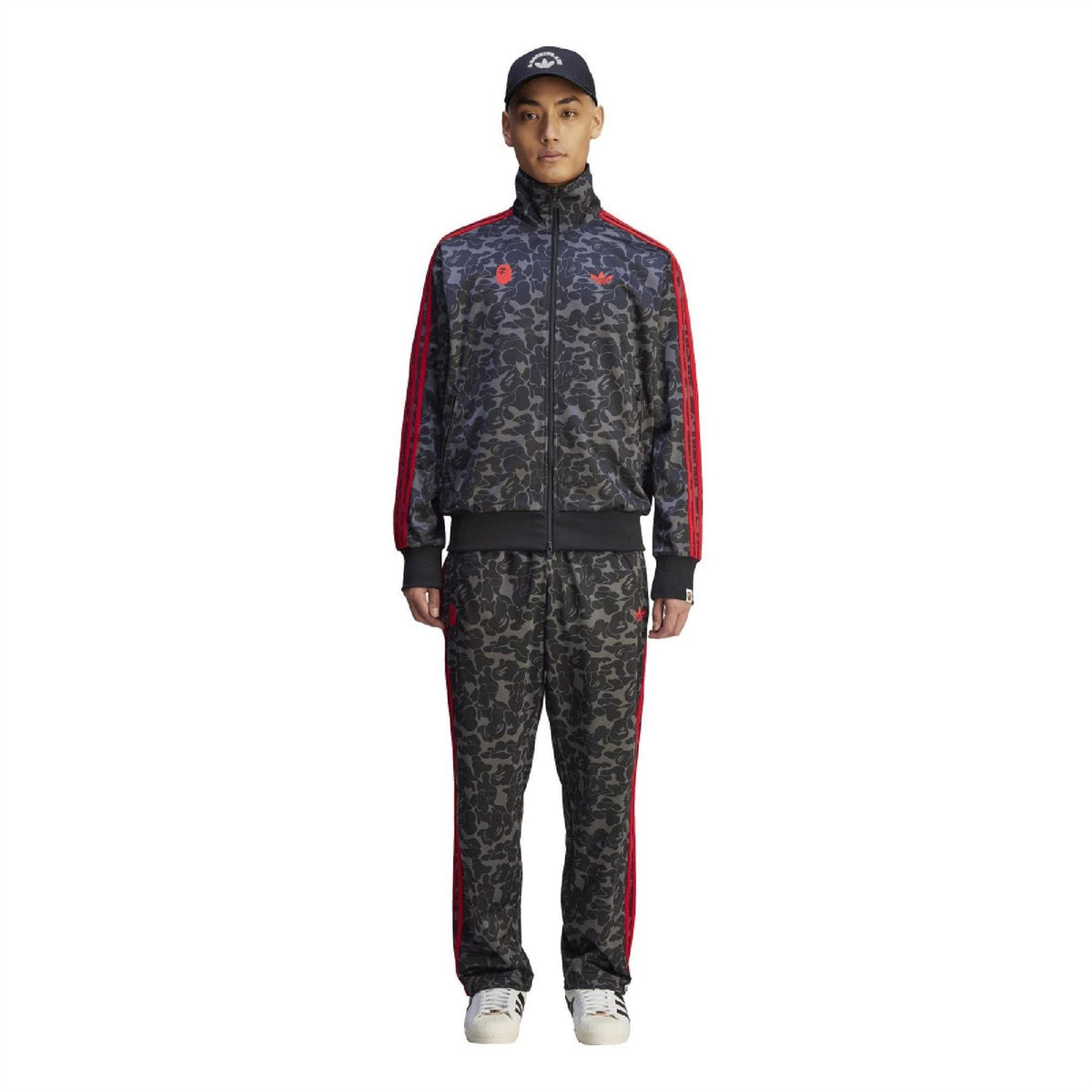 Black camo Firebird track pants with red side stripes and tapered leg