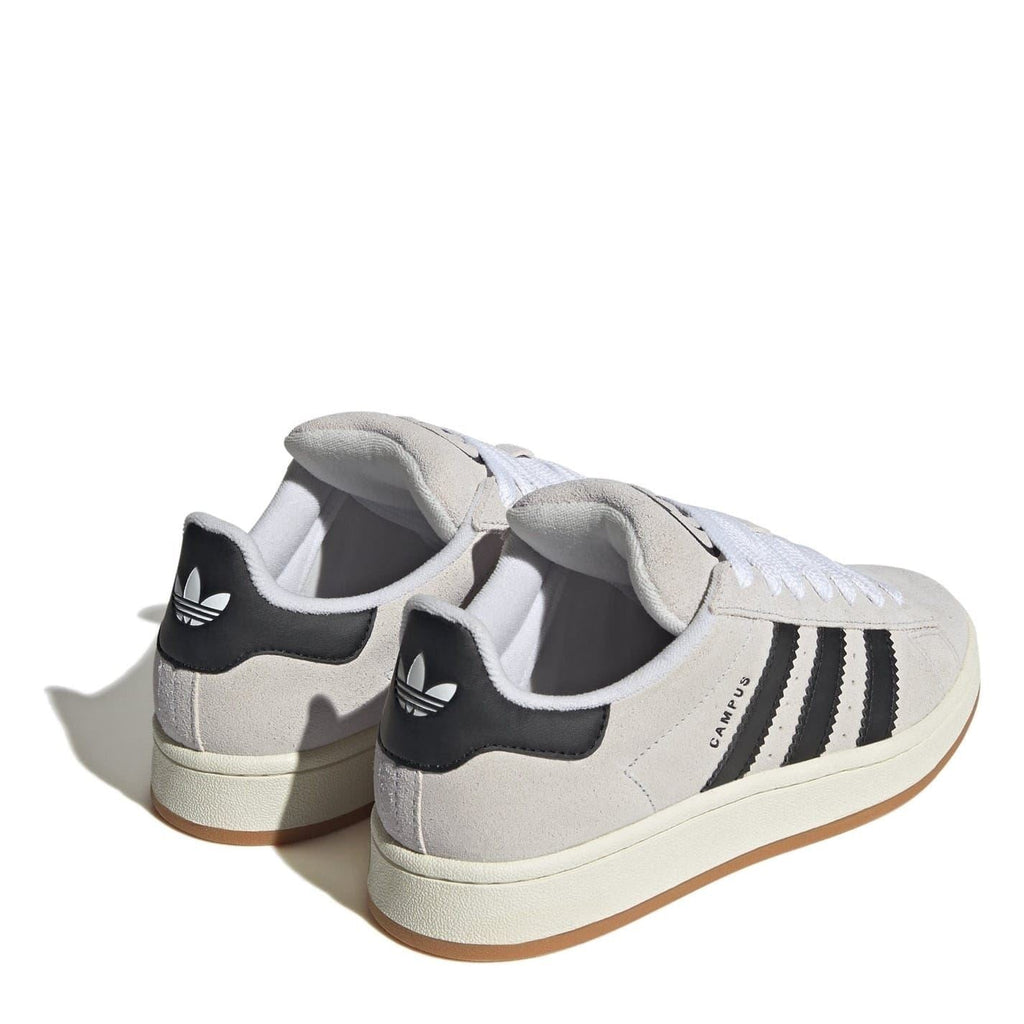 Light gray low top sneakers from the heel view with black stripe accents and white laces