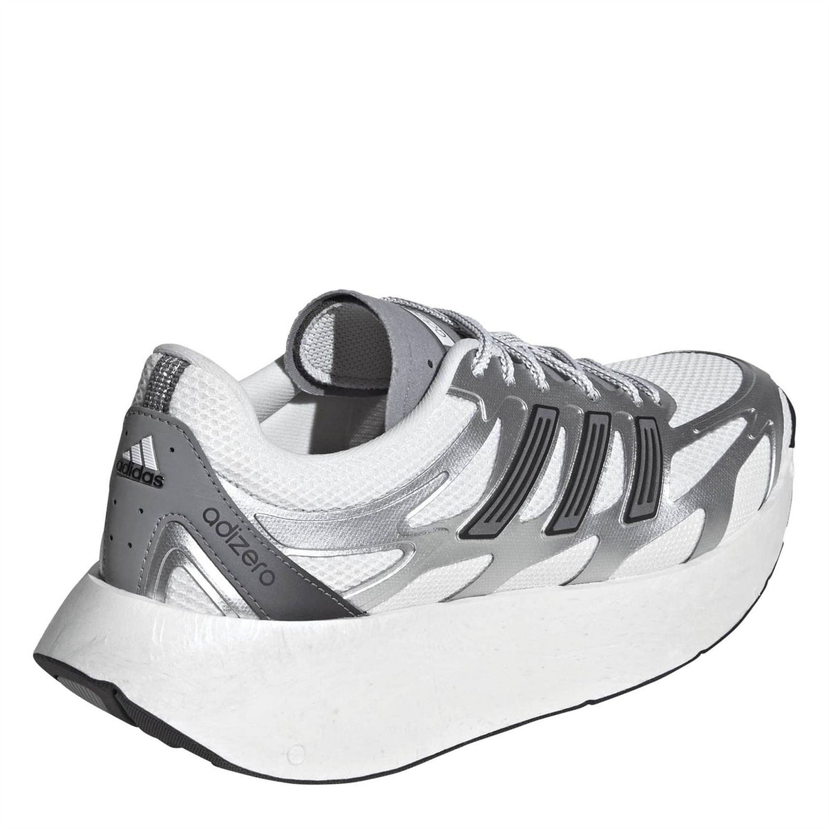 Silver and white lace-up sneakers with padded collar and visible heel and midsole