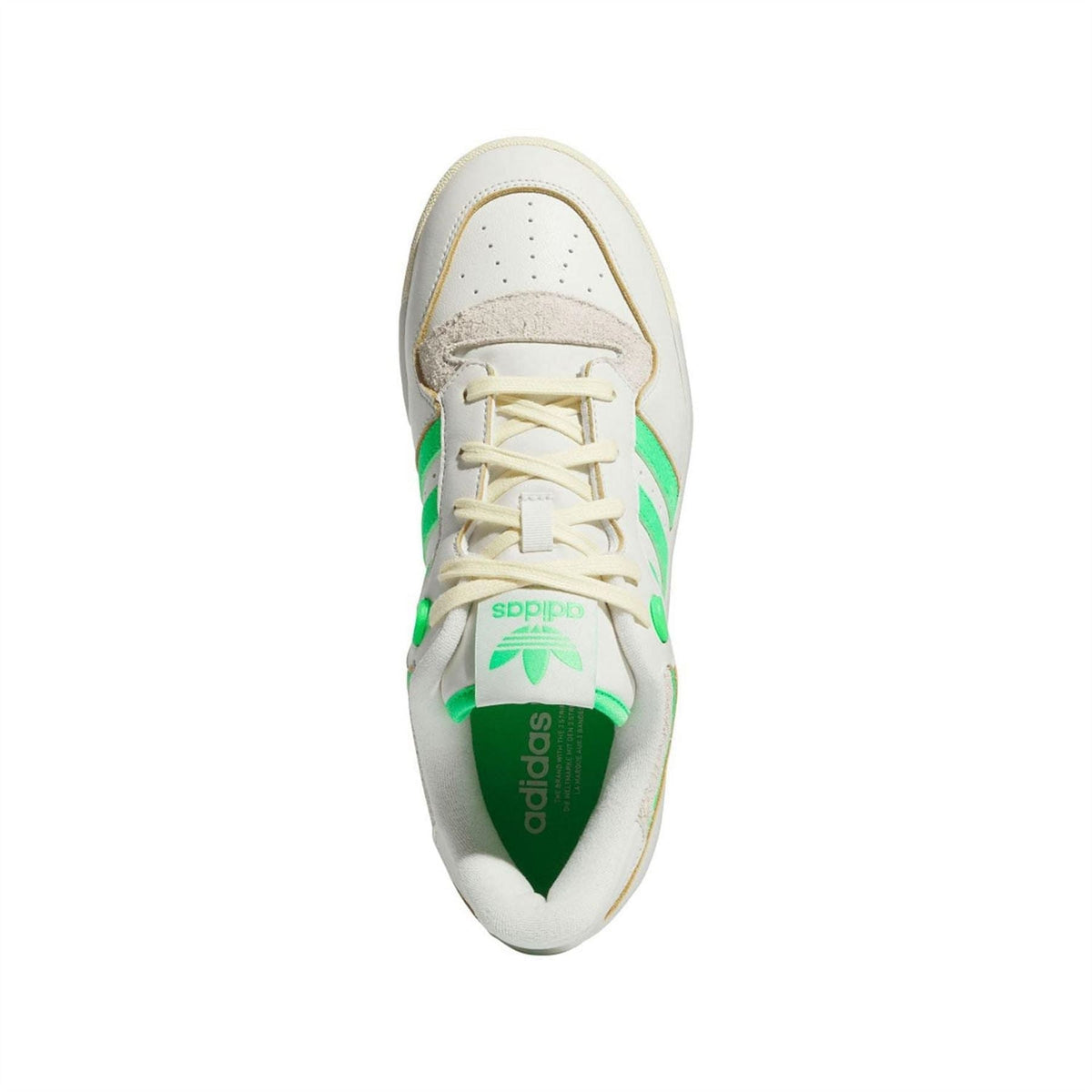 Lace-up sneaker with white upper and green accents, adidas branding on tongue