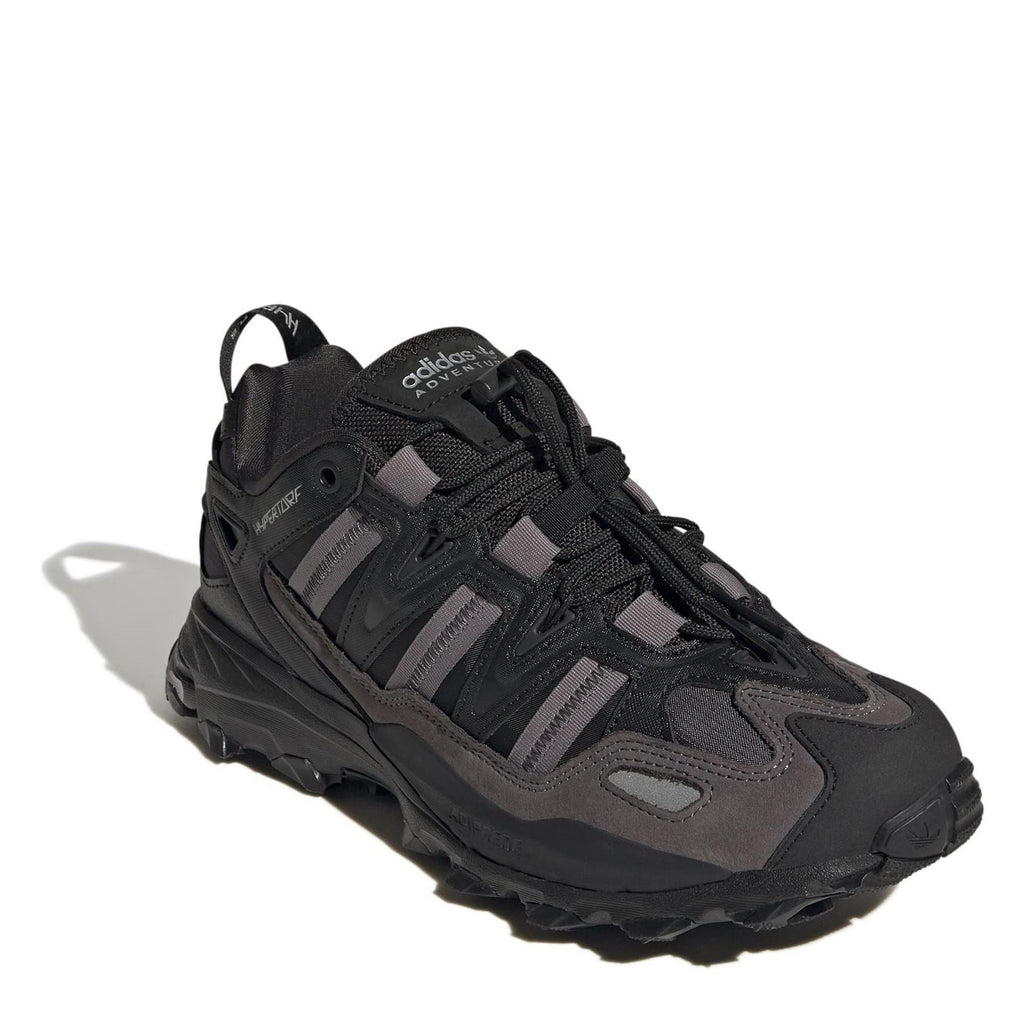 Black adidas low-top sneaker with grippy outsole and padded collar.