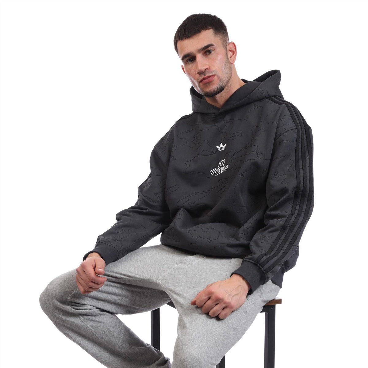Black pullover hoodie with hood and adidas trefoil chest logo