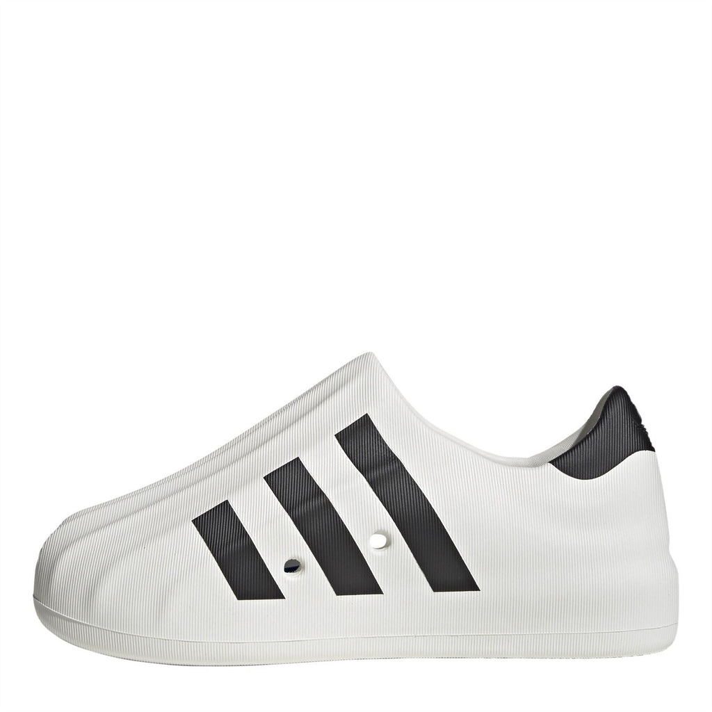 adidas Originals Superstar slip-on trainers in classic white with rubber shell toe and low-profile design, casual footwear for everyday wear