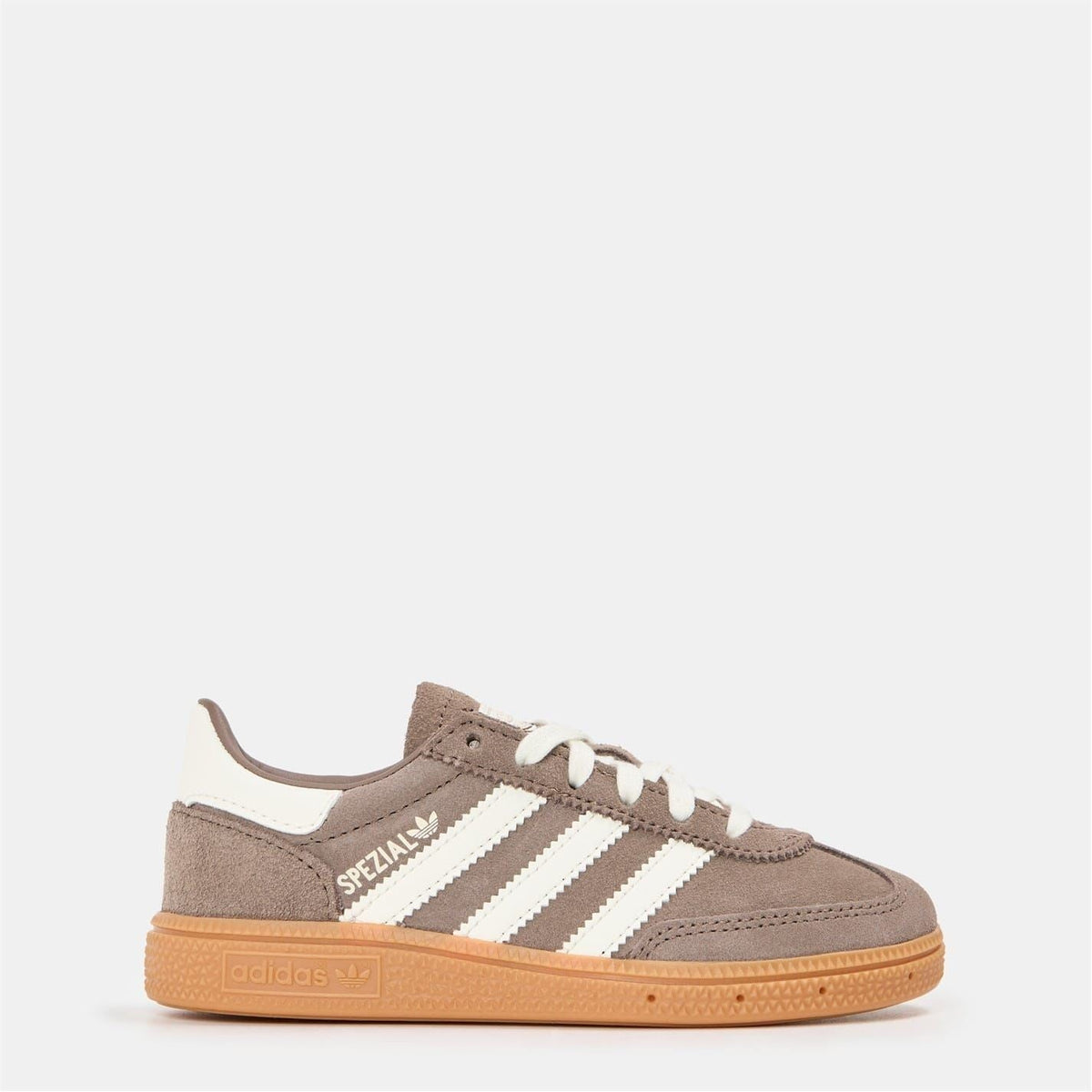 Brown suede low-top sneakers with white adidas stripes and gum rubber sole