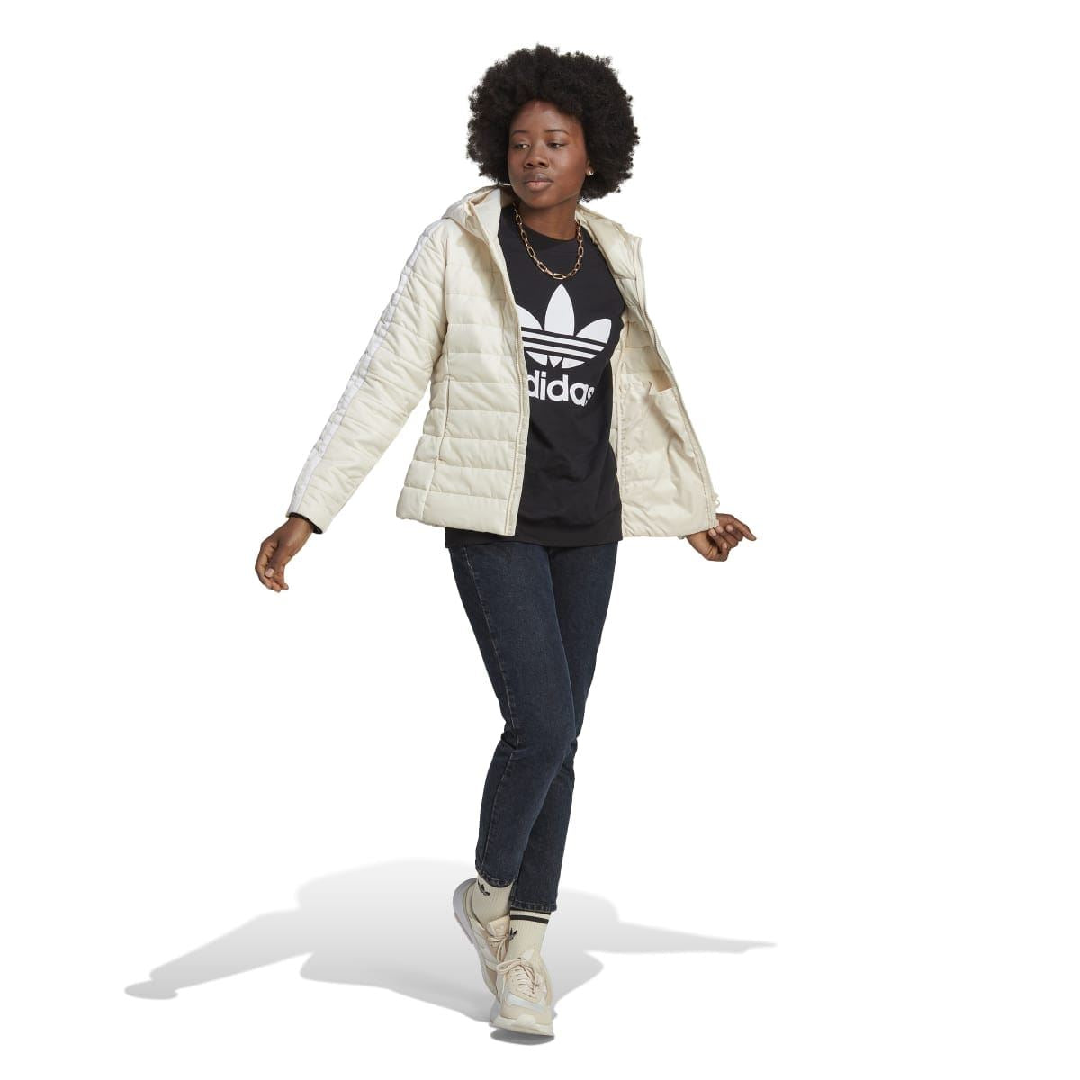 Off-white hooded puffer jacket worn over a dark graphic top, slim fit