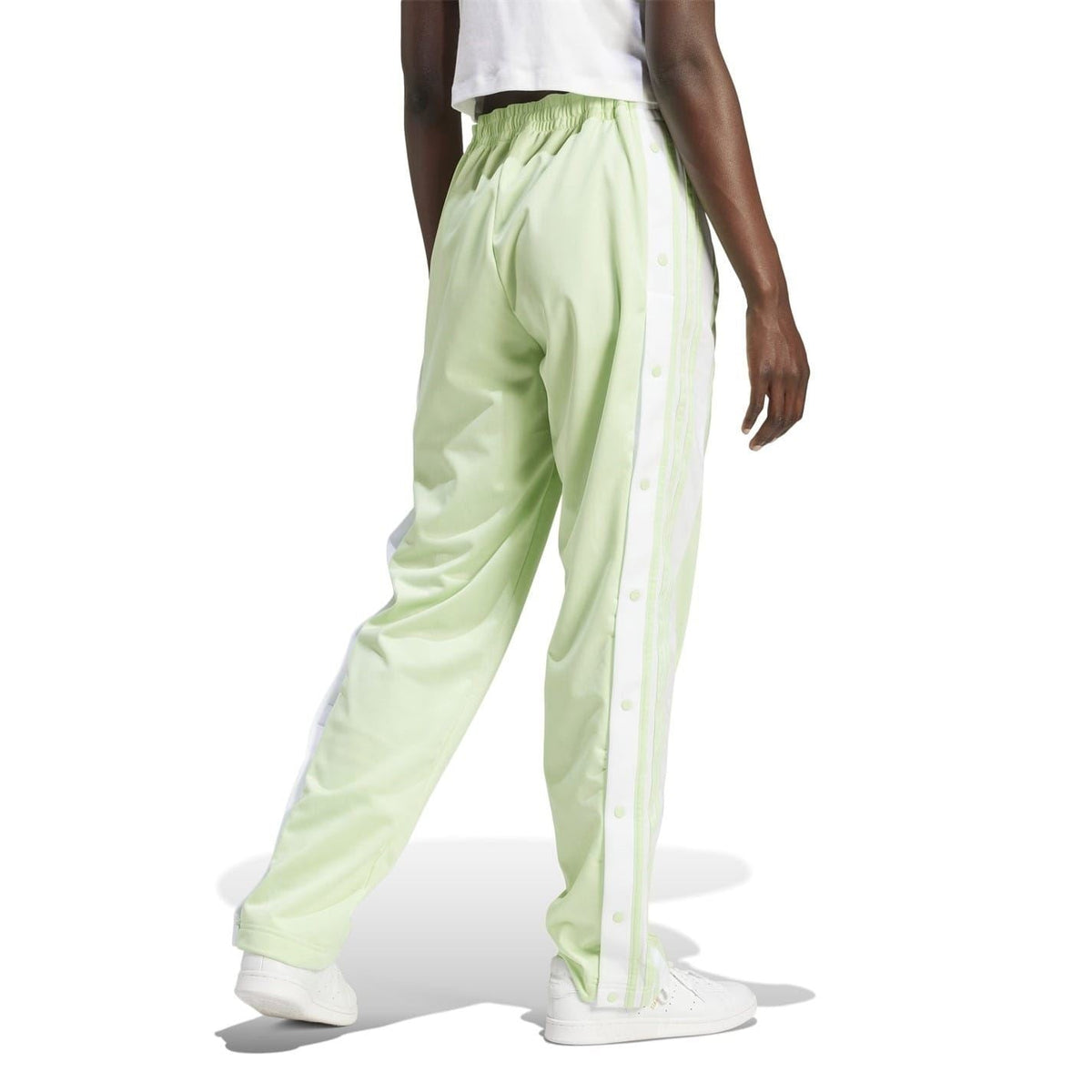 Light green track pants with elastic waistband and ankle cuff drawcord