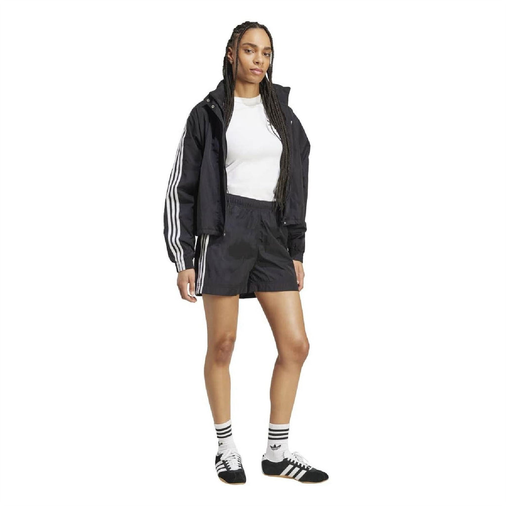 Black woven shorts with white side 3-Stripe tape, elastic waist, and logo.