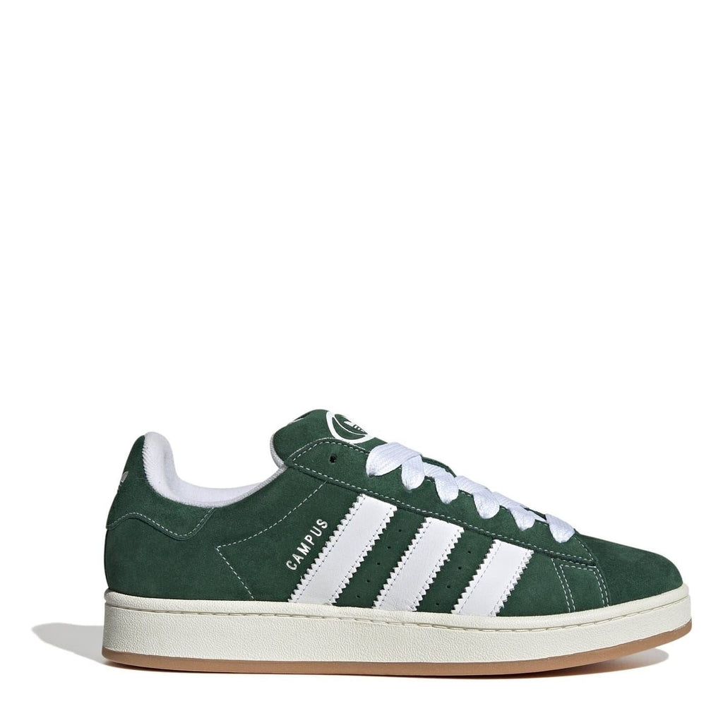 Dark green suede trainers with white adidas stripes and lace-up front, gum sole