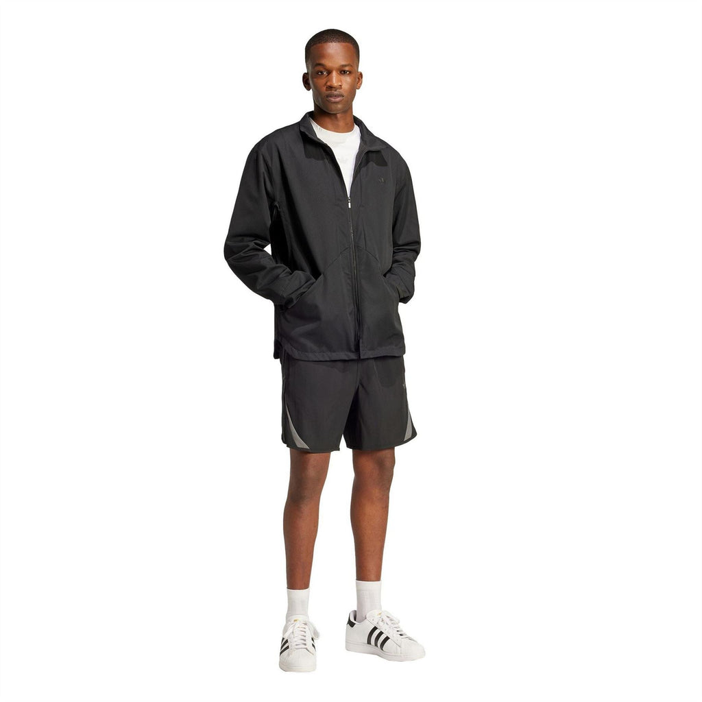 Black hooded windbreaker jacket with full-zip front, worn with black shorts