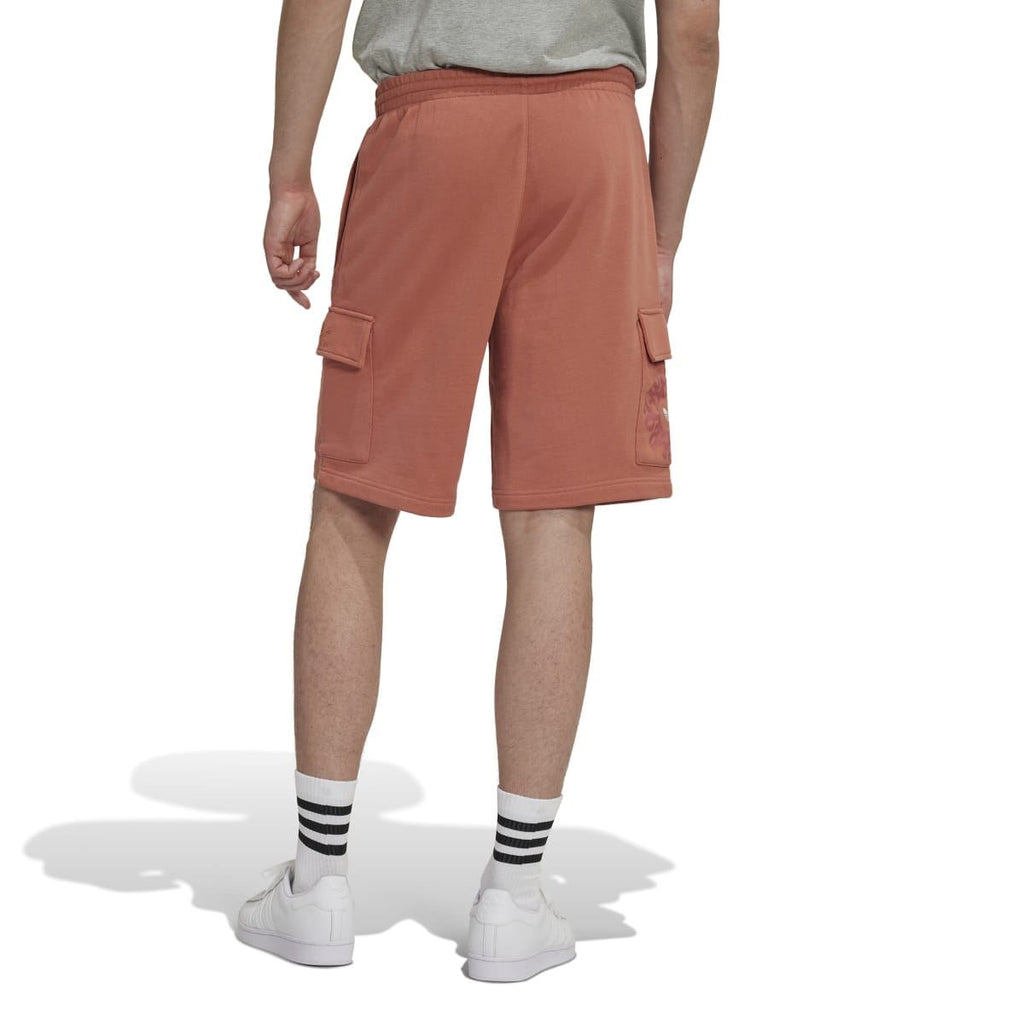 Rust-brown cargo shorts with elastic waistband and side flap pockets, rear view