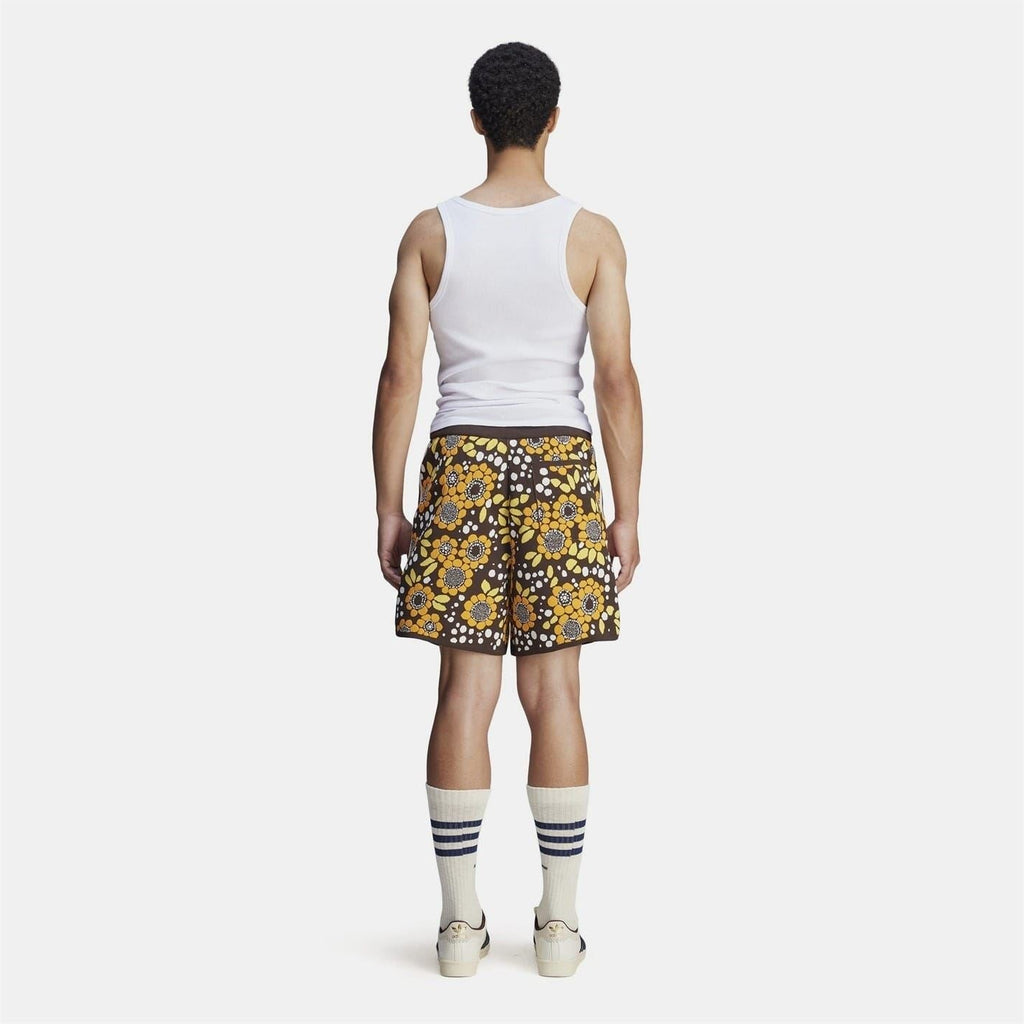 Back view of floral knit shorts with black background and multicolour flower print