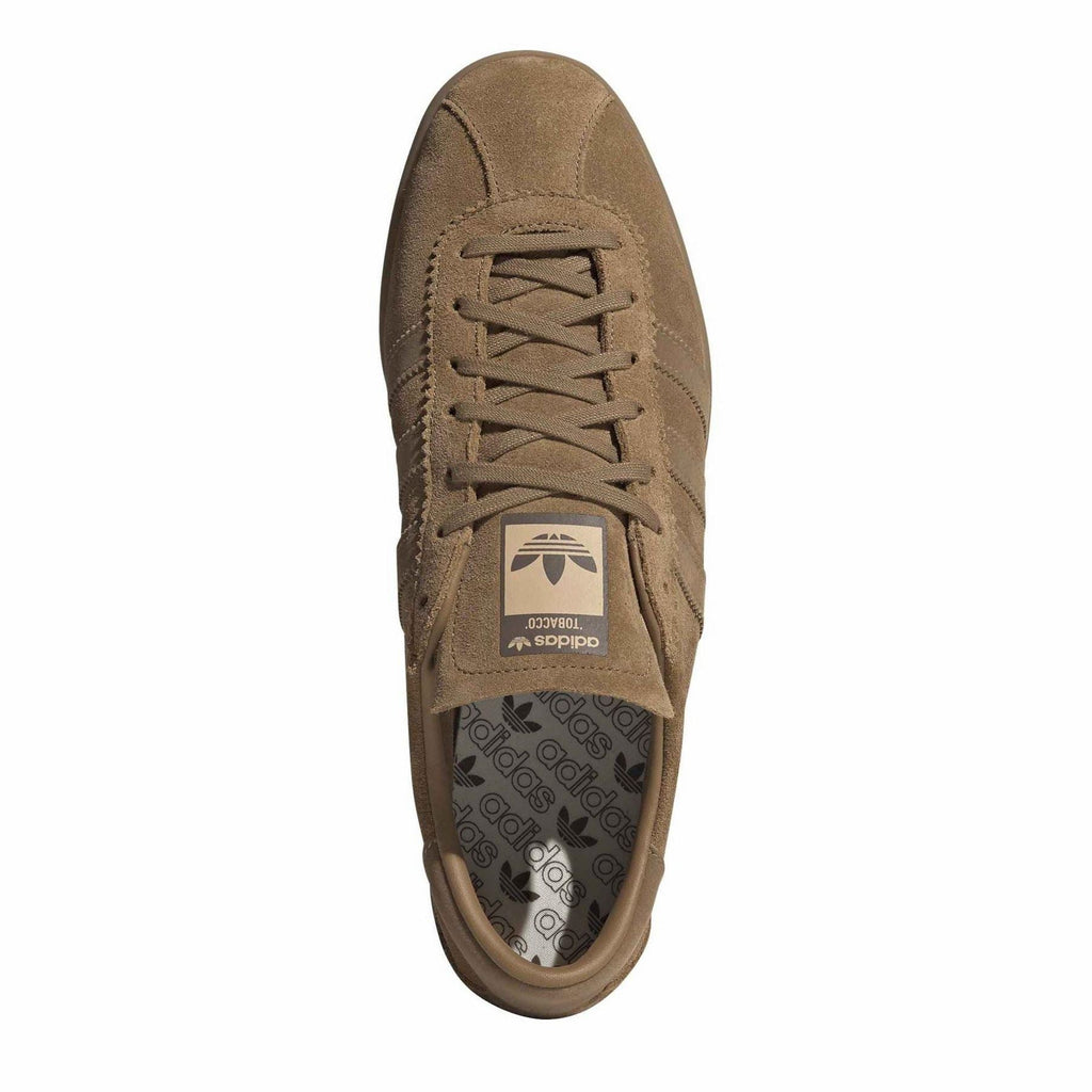 Brown lace-up adidas Originals trainers with logo patch and patterned sock liner