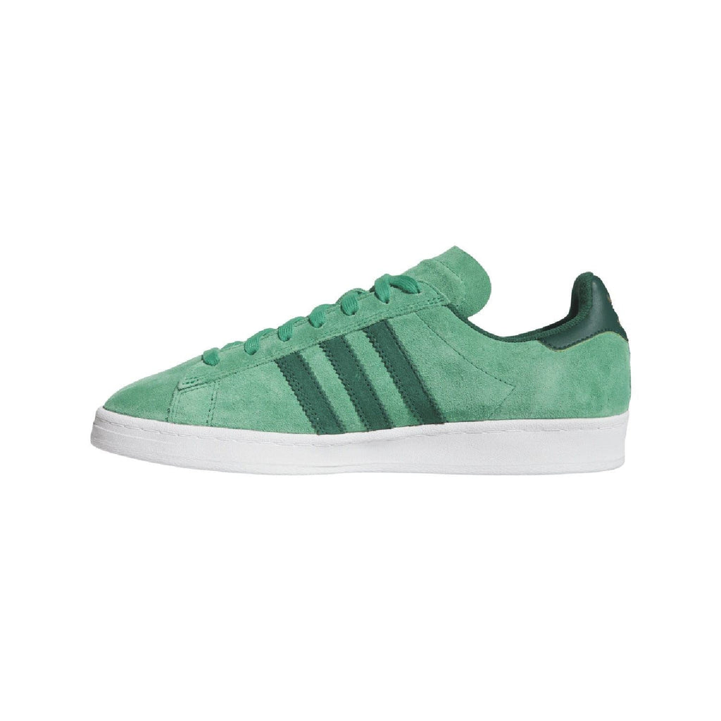Green suede low-top trainers with lace-up front, side stripes, and white sole