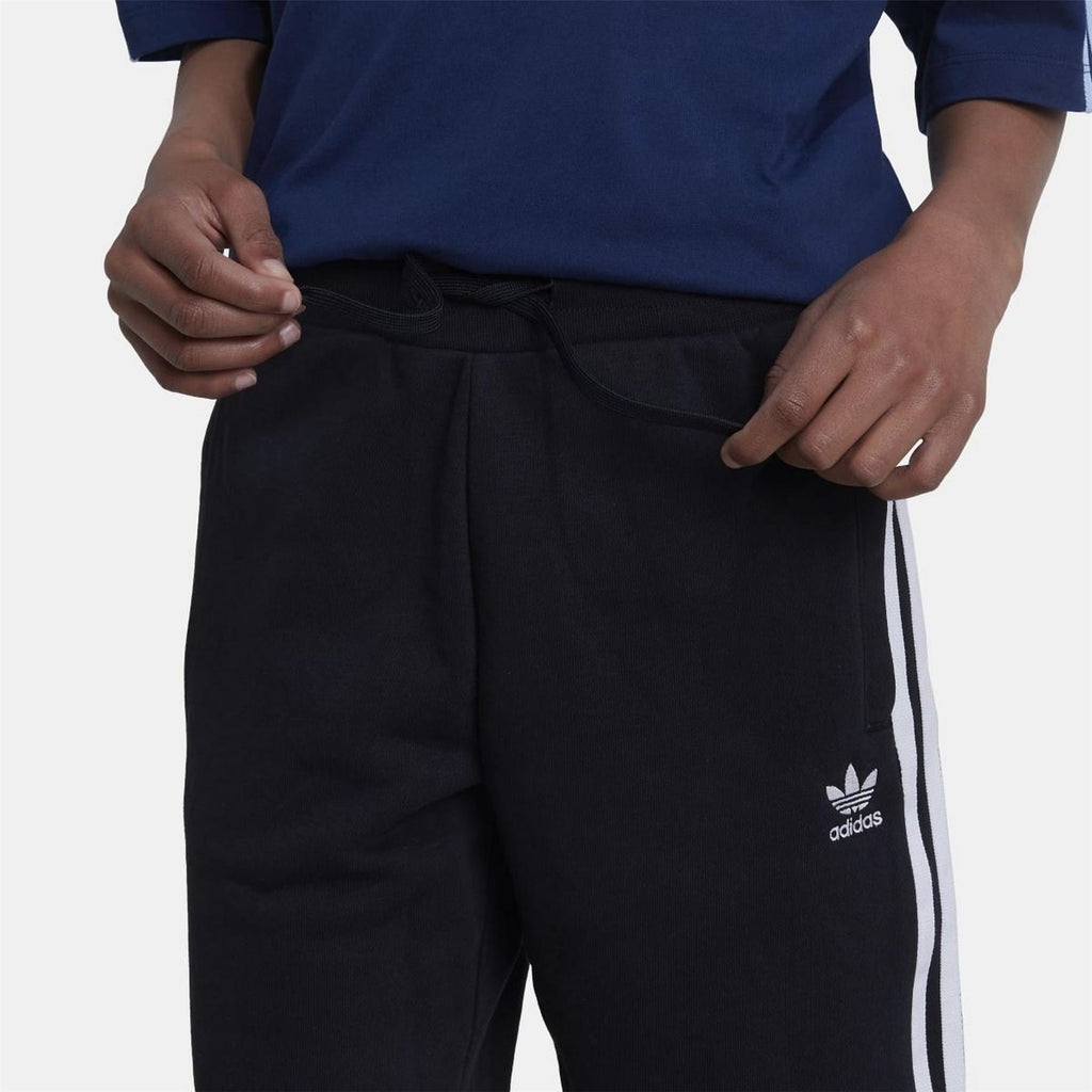 Junior adidas Originals Adicolor shorts in vibrant color, featuring elastic waistband and logo detail, suitable for ages 8-16.