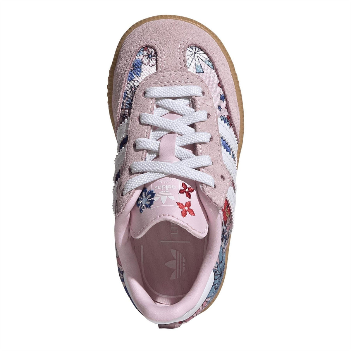Pink lace-up sneaker with floral side panels and cushioned inner lining.