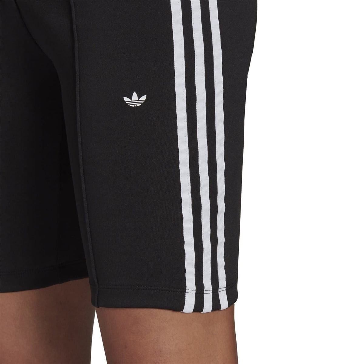Black shorts with white three stripes and small Adidas trefoil logo