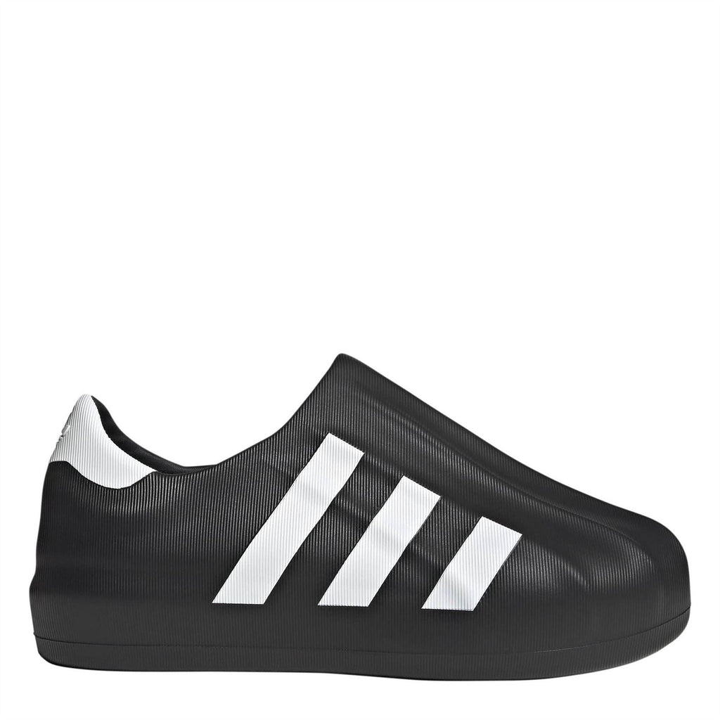Black slip-on sneakers with white adidas-style stripes and textured upper