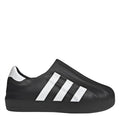Black slip-on sneakers with white adidas-style stripes and textured upper
