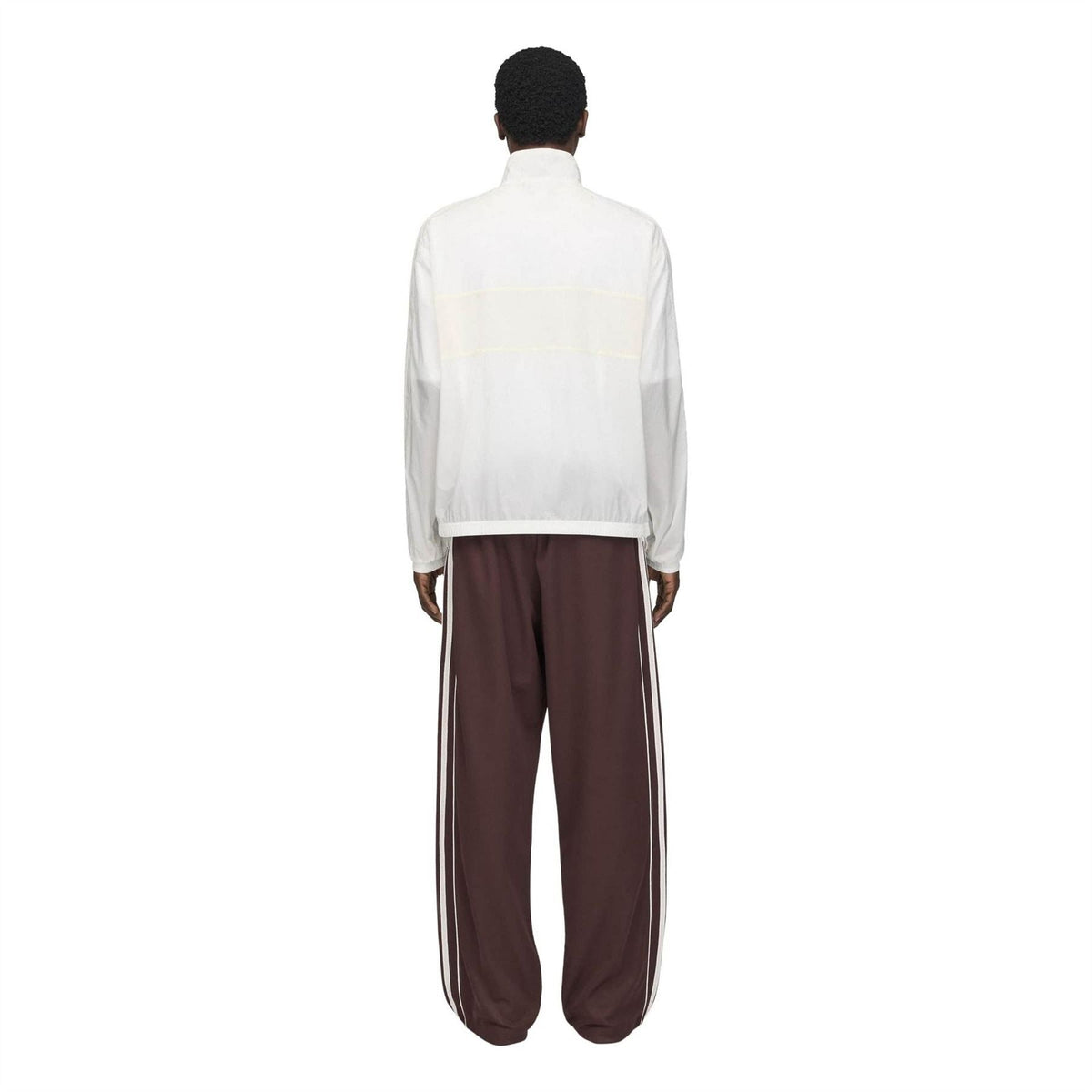 Chalk white track jacket back with stand collar, full-coverage paneling, elastic cuffs.