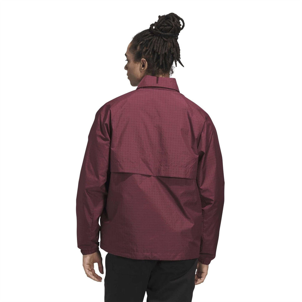Shadow red coach jacket on model, back view, stand collar, large rear panel seams