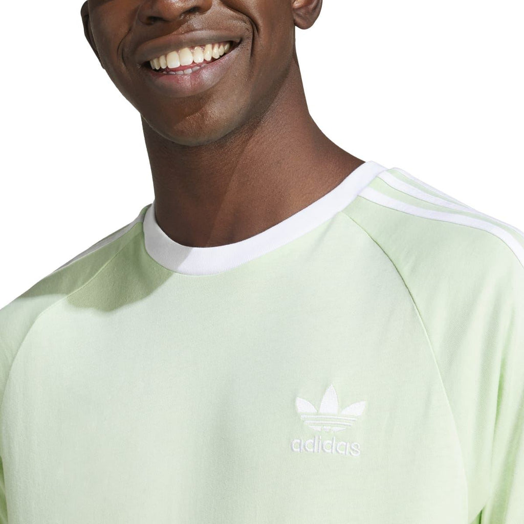 Light green adidas Originals T-shirt chest close-up with trefoil logo