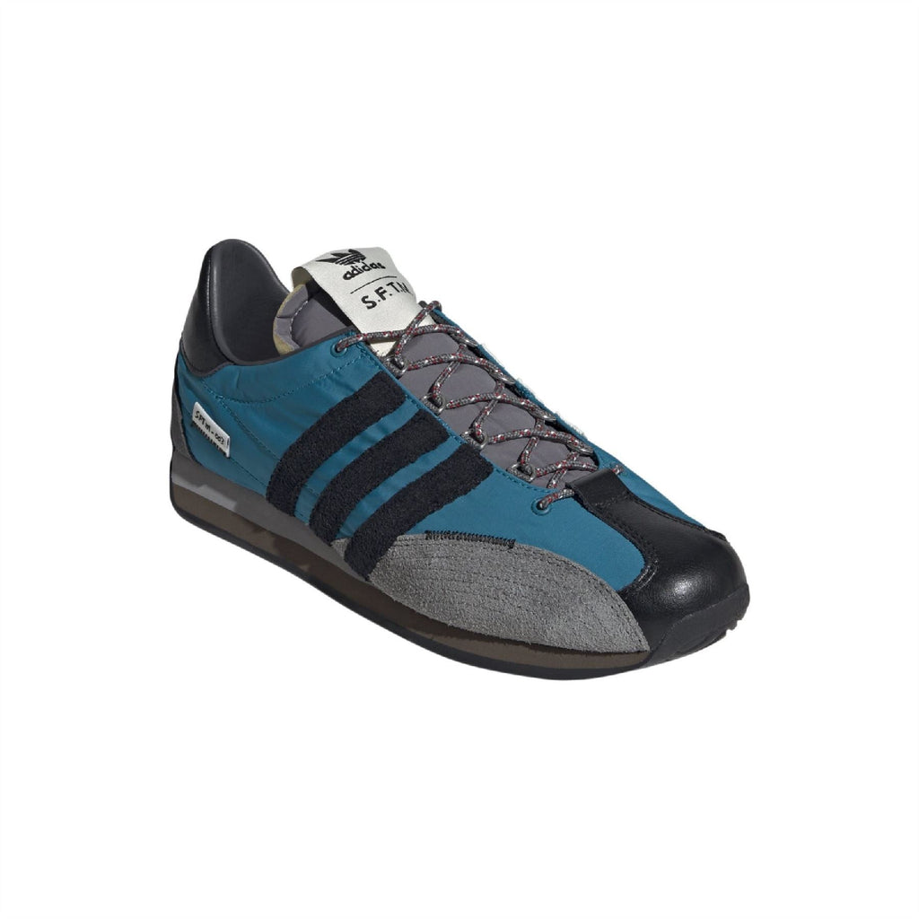 Teal and gray lace-up low-top trainers with black leather heel and three stripe design