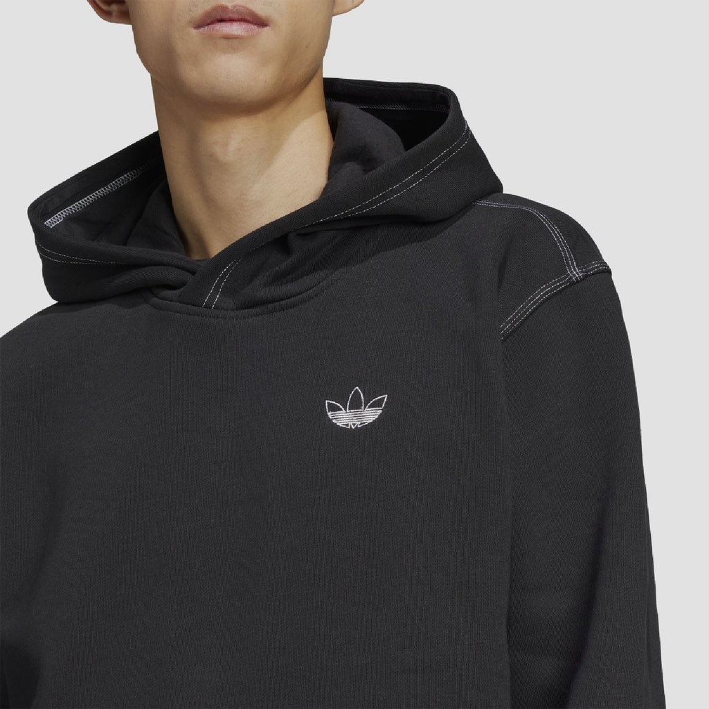 Black adidas Originals hoodie chest with small trefoil logo and hood neckline