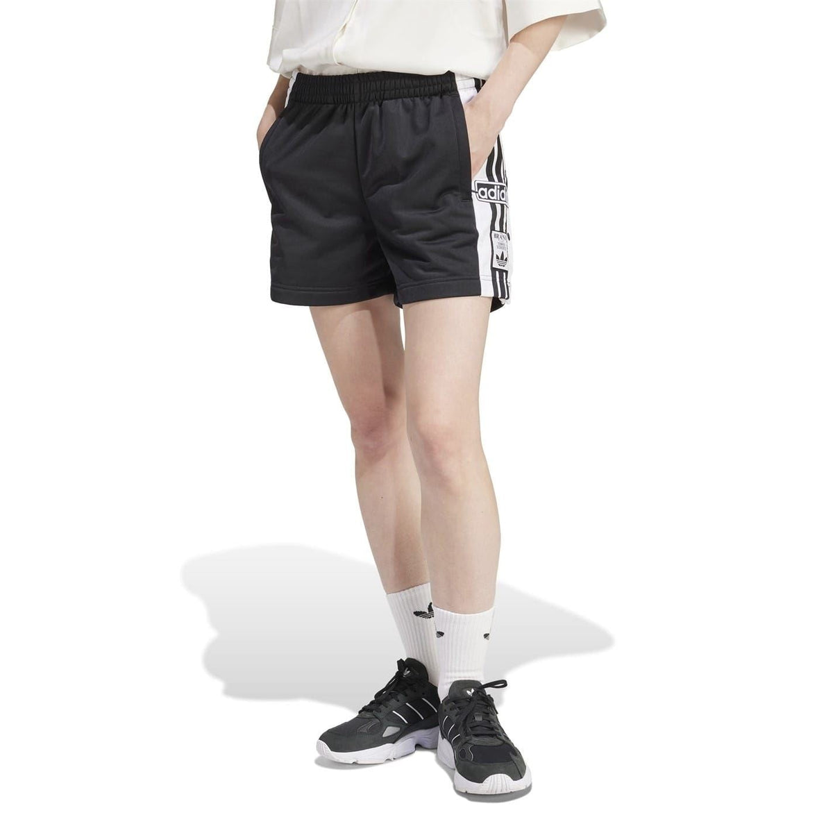 adidas Adibreak athletic shorts, black with elastic waist and white side logo stripe