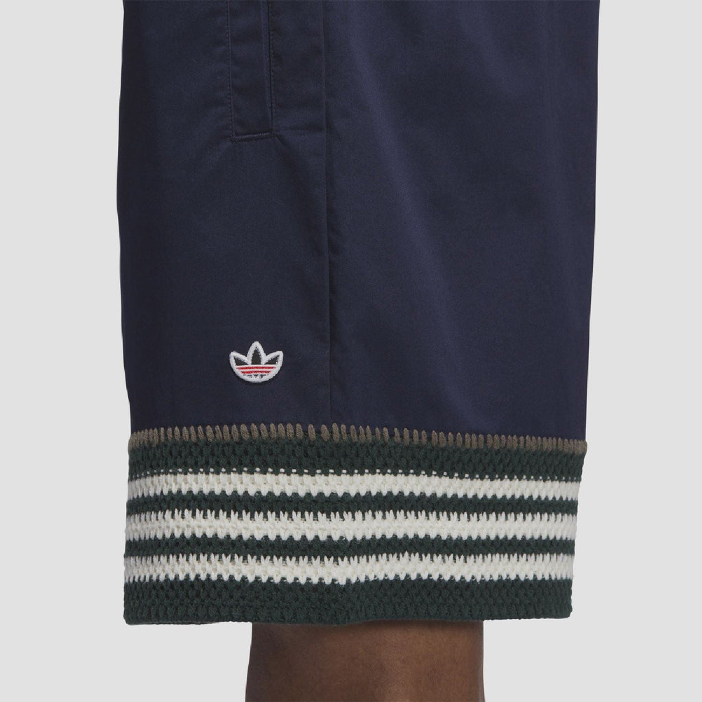 Indigo knit shorts hem with trefoil logo and ribbed striped band detail