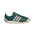 Green and white adidas Originals low-top trainers with three stripes and gum sole
