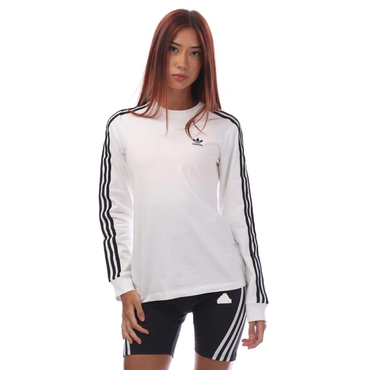 White long-sleeve top with black 3-stripe sleeves and small chest trefoil logo