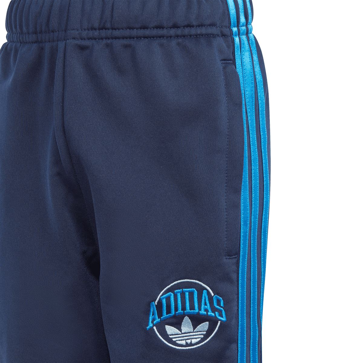 Infant adidas indigo jogger pants with blue side stripe and small adidas logo patch