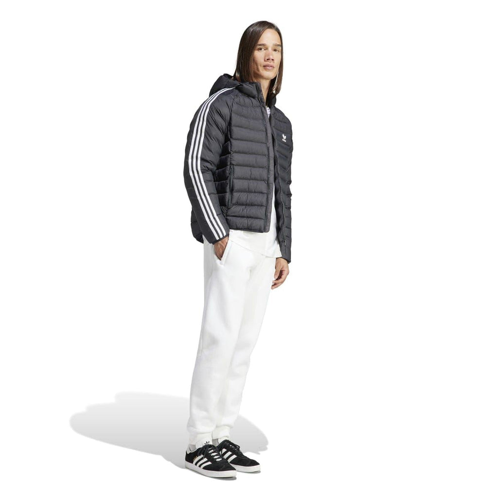 Black hooded puffer jacket worn with white pants; full zip and white sleeve stripes