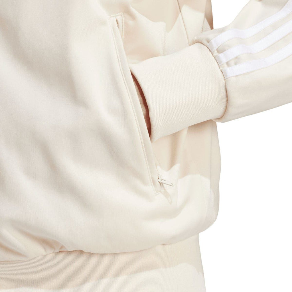 adidas Originals white track top sleeve close-up: zip pocket and ribbed cuff