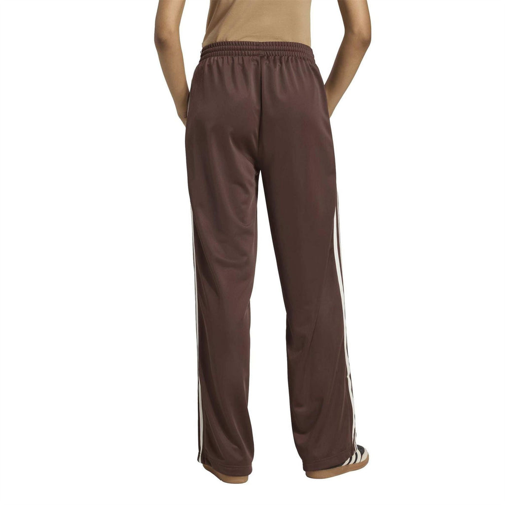 Brown adidas track pants with straight leg and white side stripe detailing