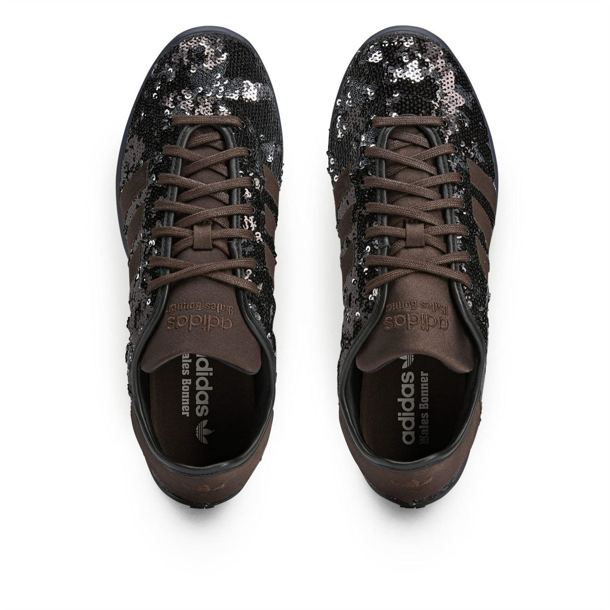 Pair of Core Black sequin lace-up sneakers, top view with brown laces