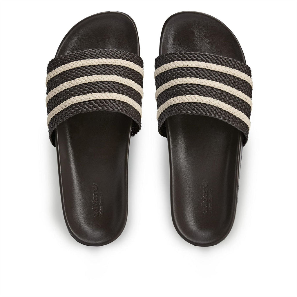 Dark brown adidas adilette slides, two-piece top with cream triple stripe braid