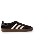 Black suede-look Gazelle pony shoes with white three stripes, brown gum sole, lace-up.