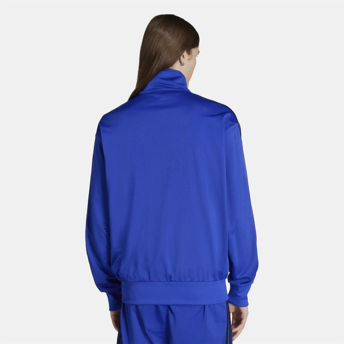 adidas Originals Classics Firebird Track Top in black with white accents, featuring a zip-up front and ribbed cuffs.
