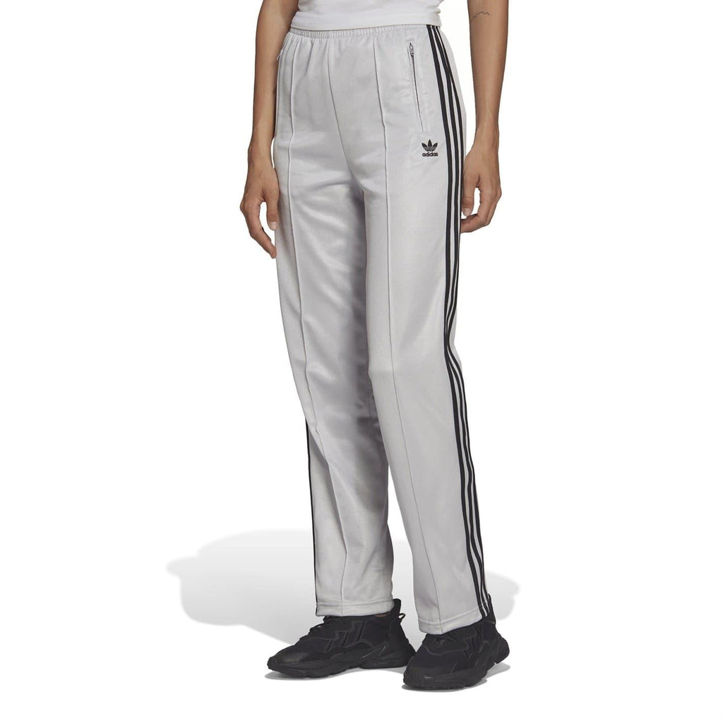 Light gray adidas Originals sweatpants with black side stripes and trefoil logo
