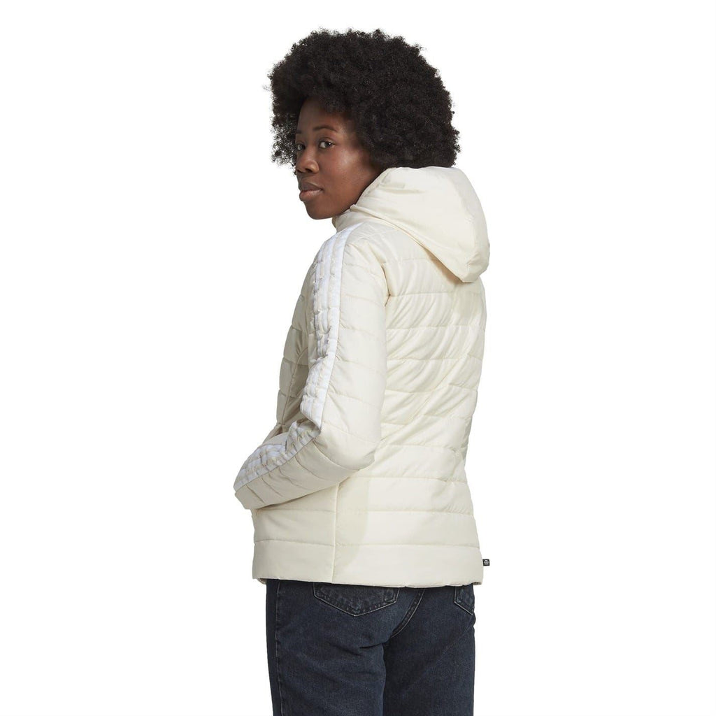 Light cream hooded puffer jacket, side view, quilted panels, full zip closure.