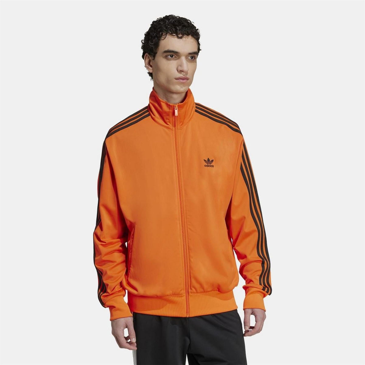 Orange adidas Originals Firebird track top with black sleeve stripes and zip front