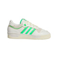 Low-top trainers with white leather-look upper and green three-stripe side panels