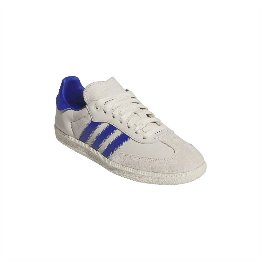 White and blue adidas Originals Samba trainers, angled view with blue heel collar