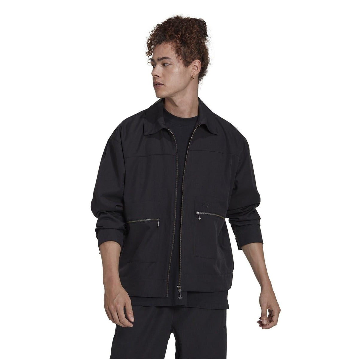 Black zip-up jacket with stand collar, two chest pockets, and long sleeves