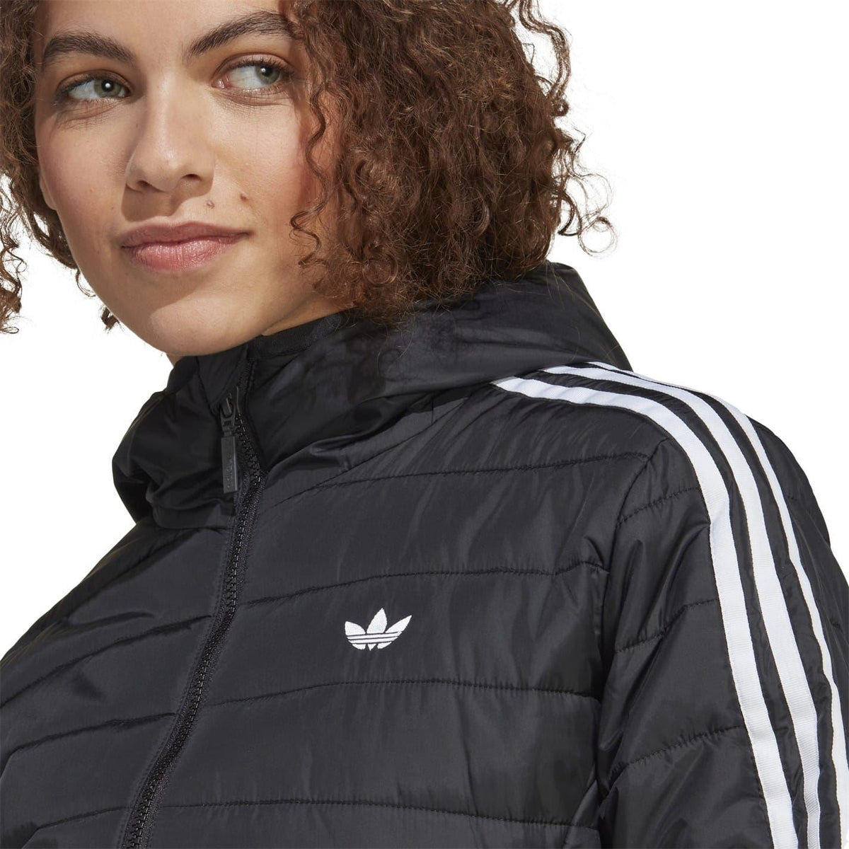Black hooded puffer jacket close-up with adidas trefoil logo and white sleeve stripes