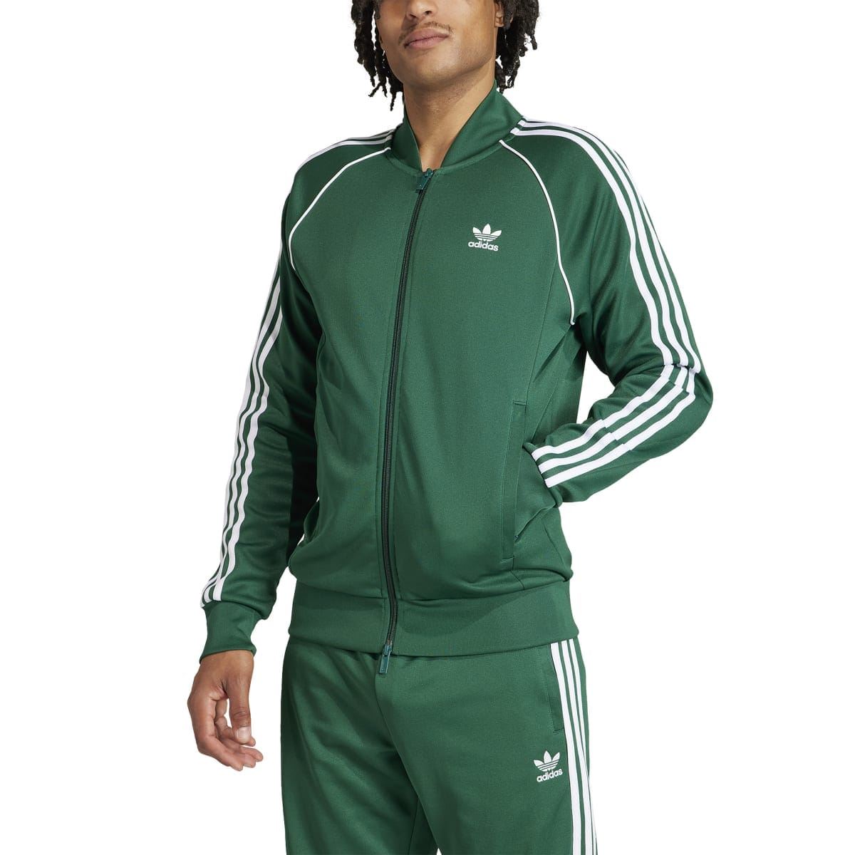 Green adidas track jacket on model, three white stripes down sleeves, full zip front