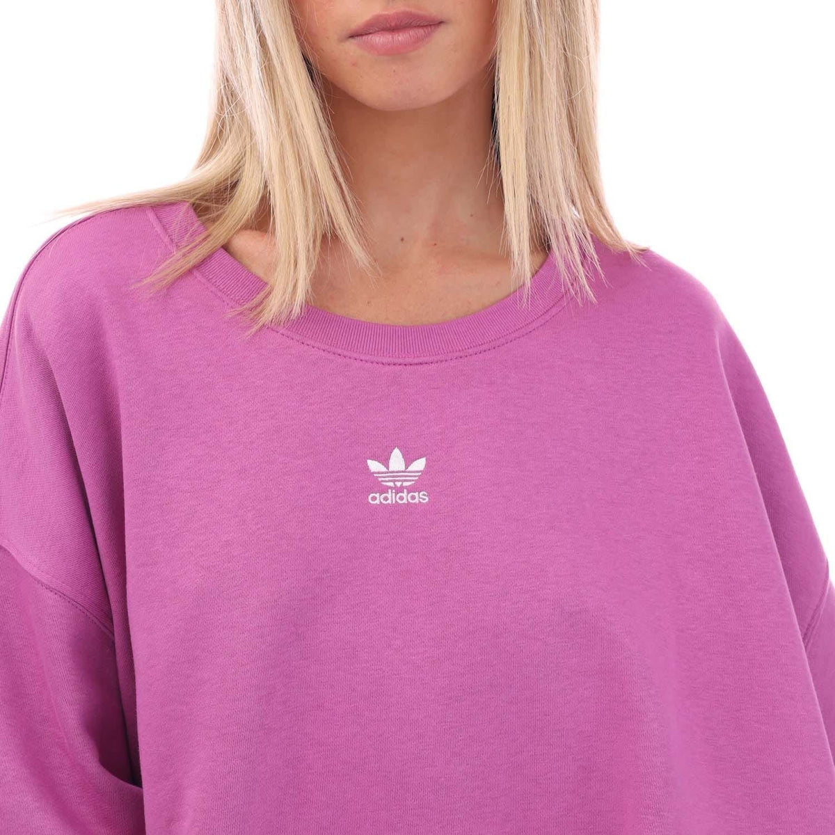 Lilac crewneck sweatshirt with small adidas logo on chest, ribbed neckline